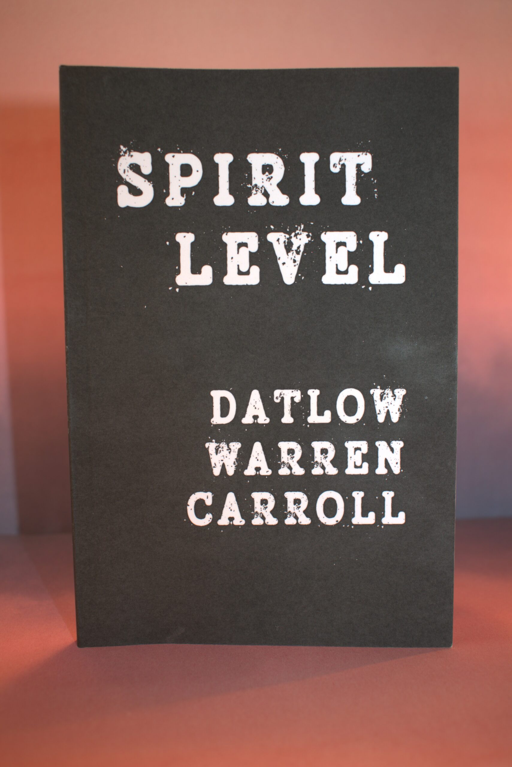 Spirit Level book cover with distressed typography